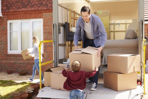 Removals and storage services in Woodfordgreen with moving boxes and a removal van