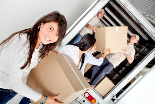 Family house relocation with careful loading by a removals crew