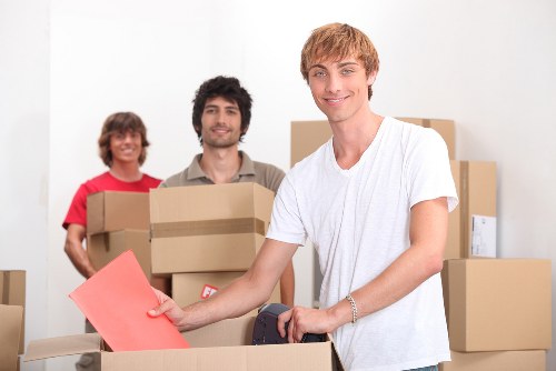 Office furniture being loaded for a small business removal